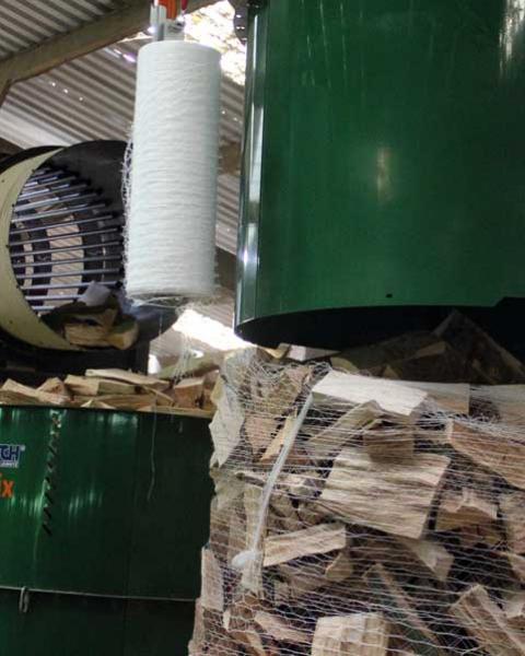 dropping into a drum where, once filled, it is wrapped